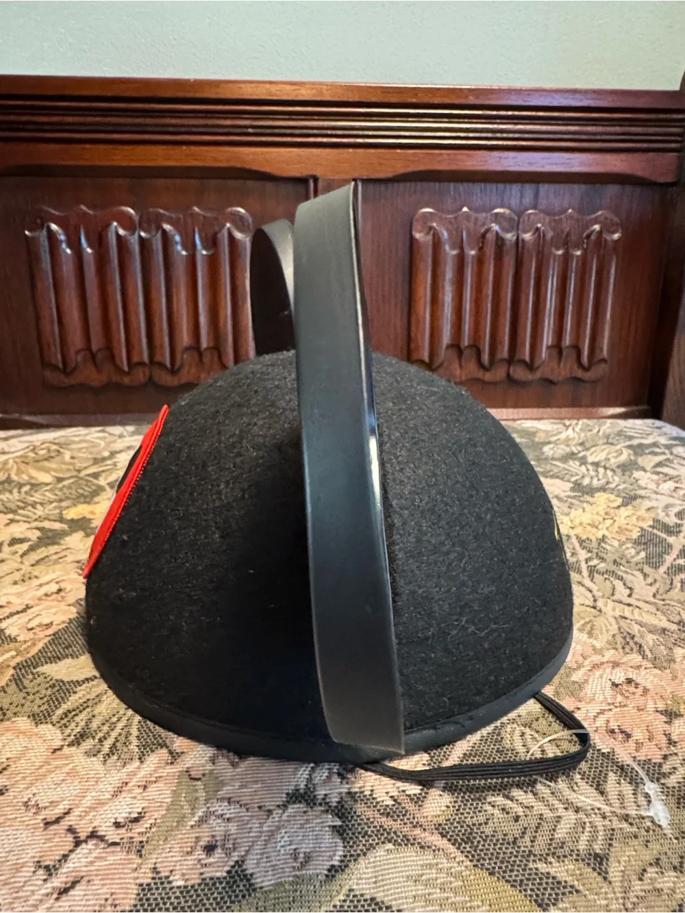 Disney black Mickey Mouse ears hat with red patch.